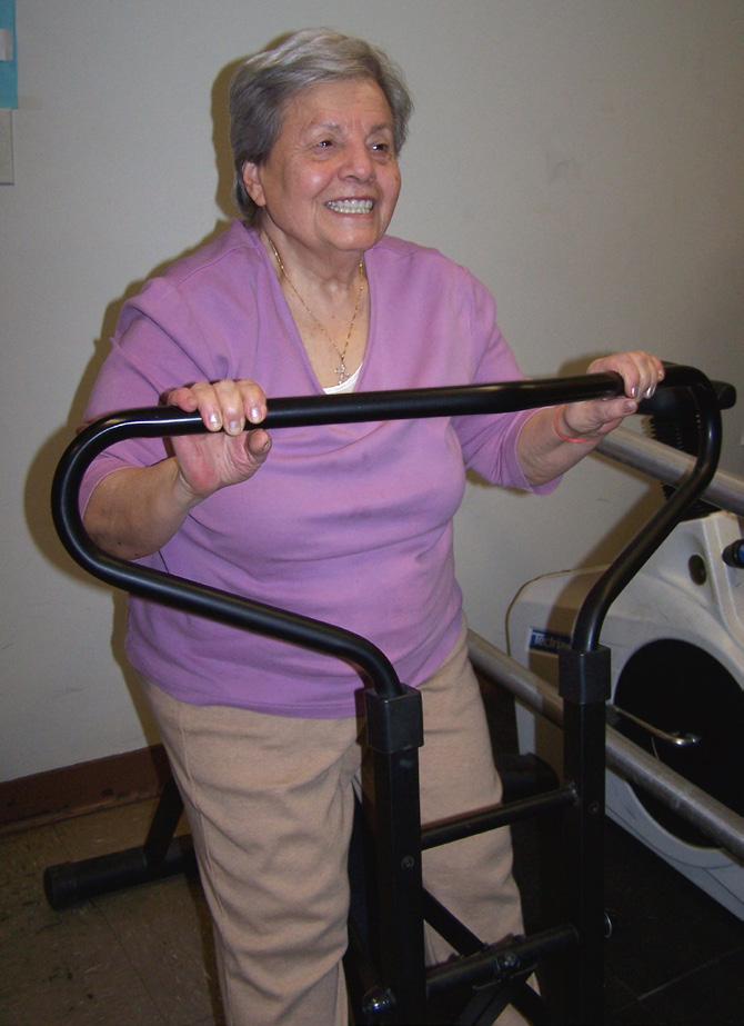 older lady in pink on old school workout equipment