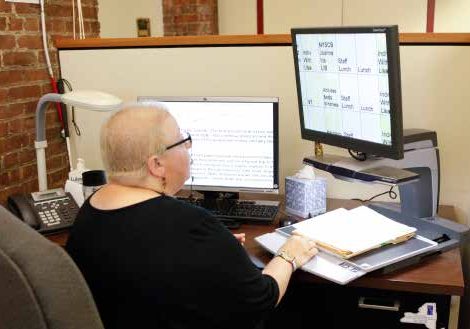 lady at her desk working computer