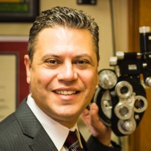 Image of Bryan Wolynski in his office, smiling to the camera.