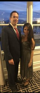 Image of Jan and Saira Weitz standing together outside.