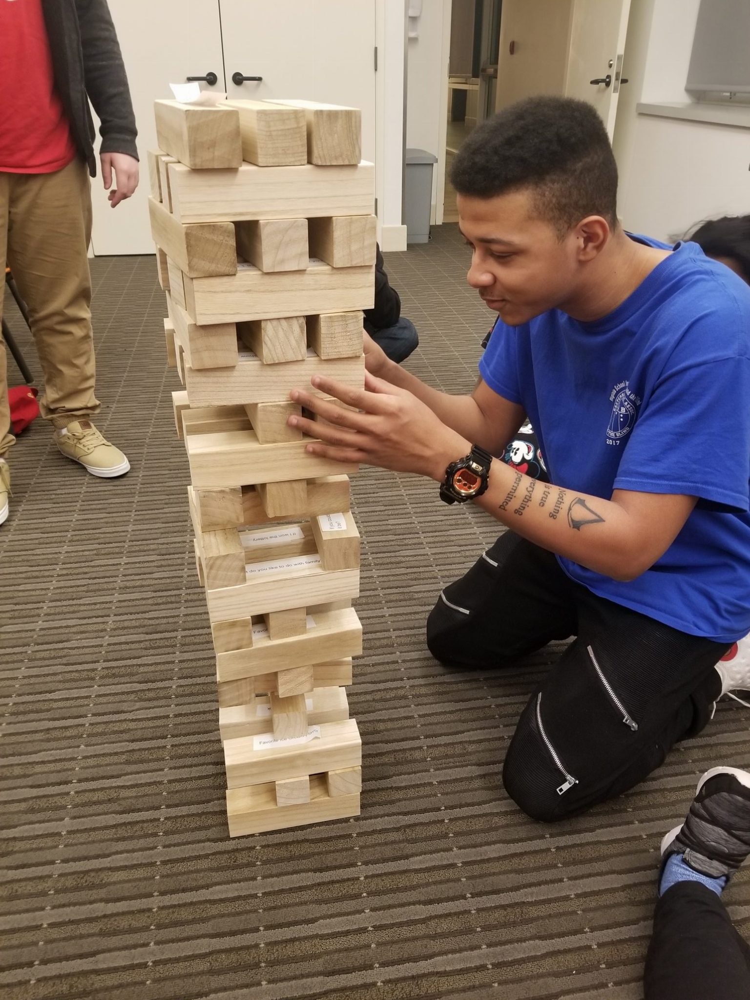 Malik Blount playing huge jenga