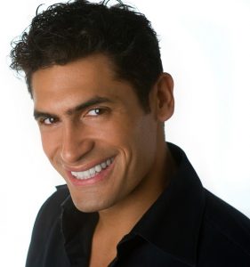 Image of Mario Calderon smiling to the camera.